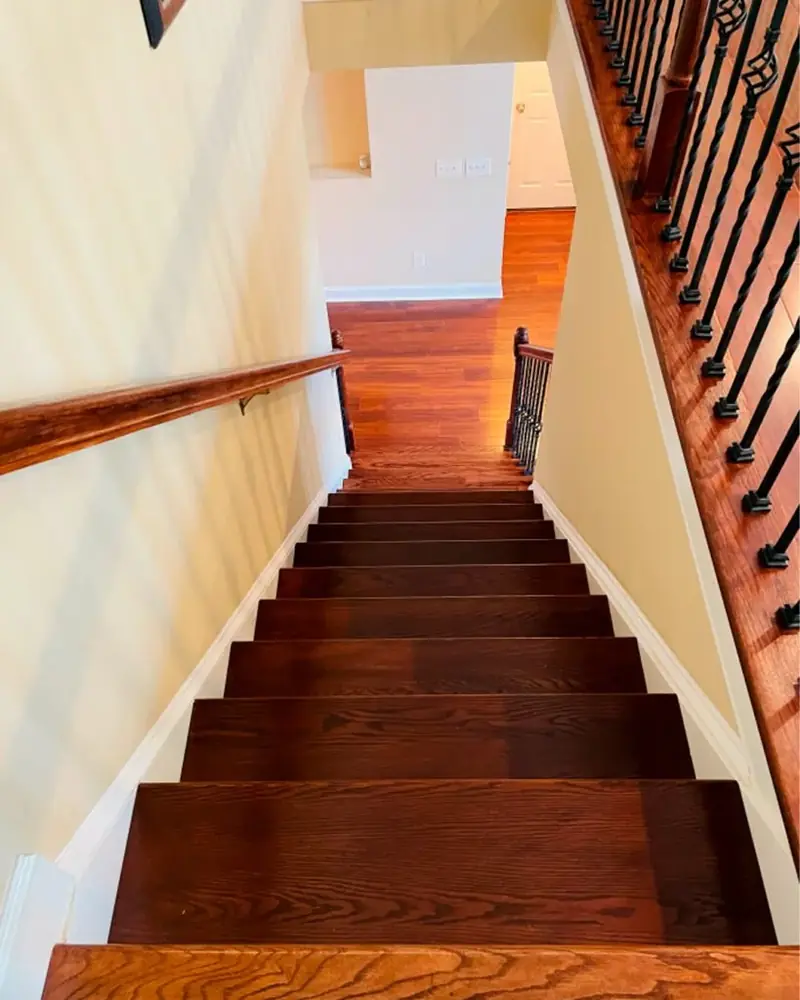 Stained stair treads seen from the top of the stairs